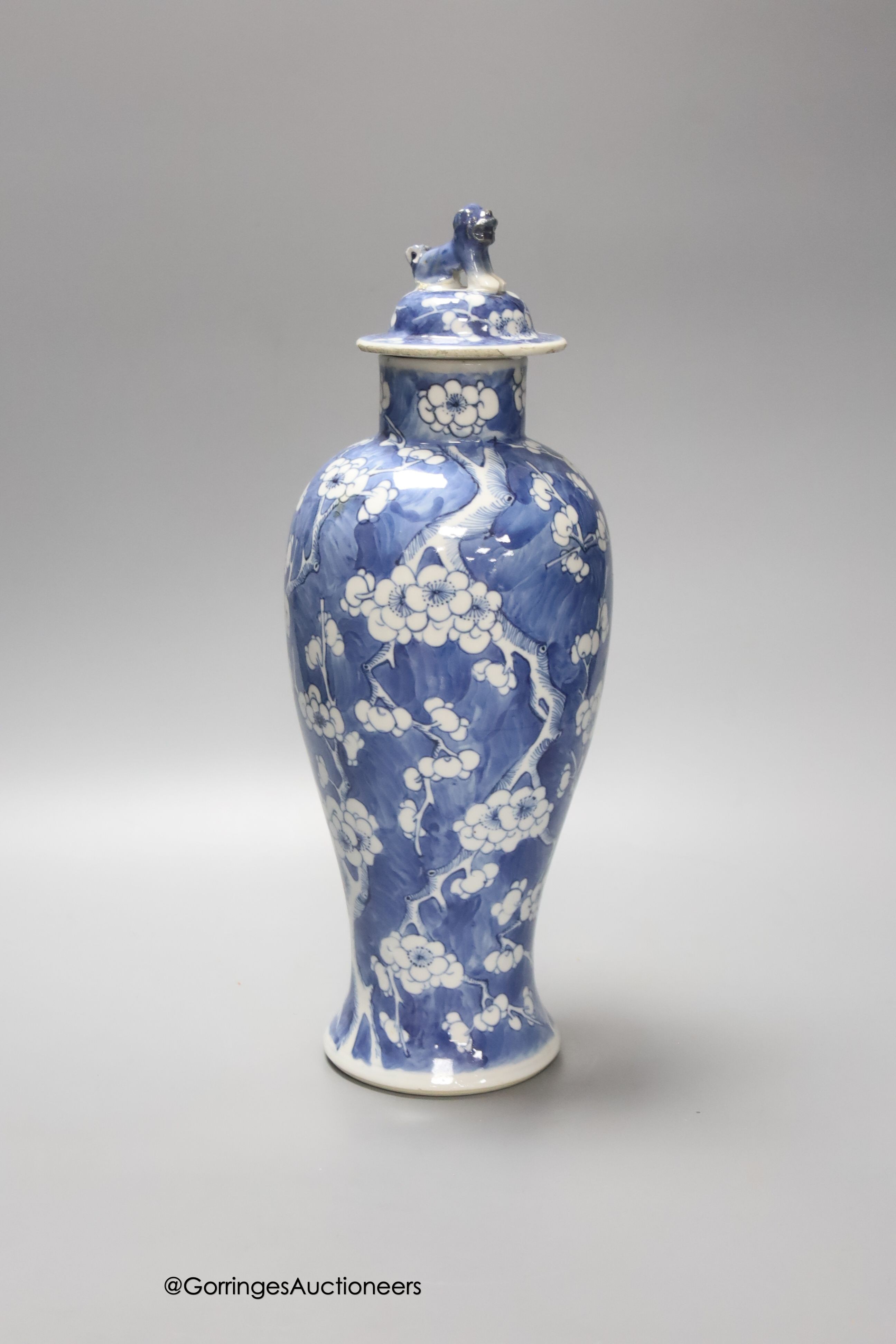 A 19th century Chinese blue and white 'prunus' vase and cover, height 33cm